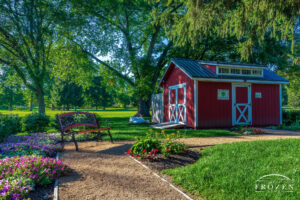 A bench sitting in the solitude of the Round-about portion of the Kiwanis Children’s Garden in Springfield Ohio