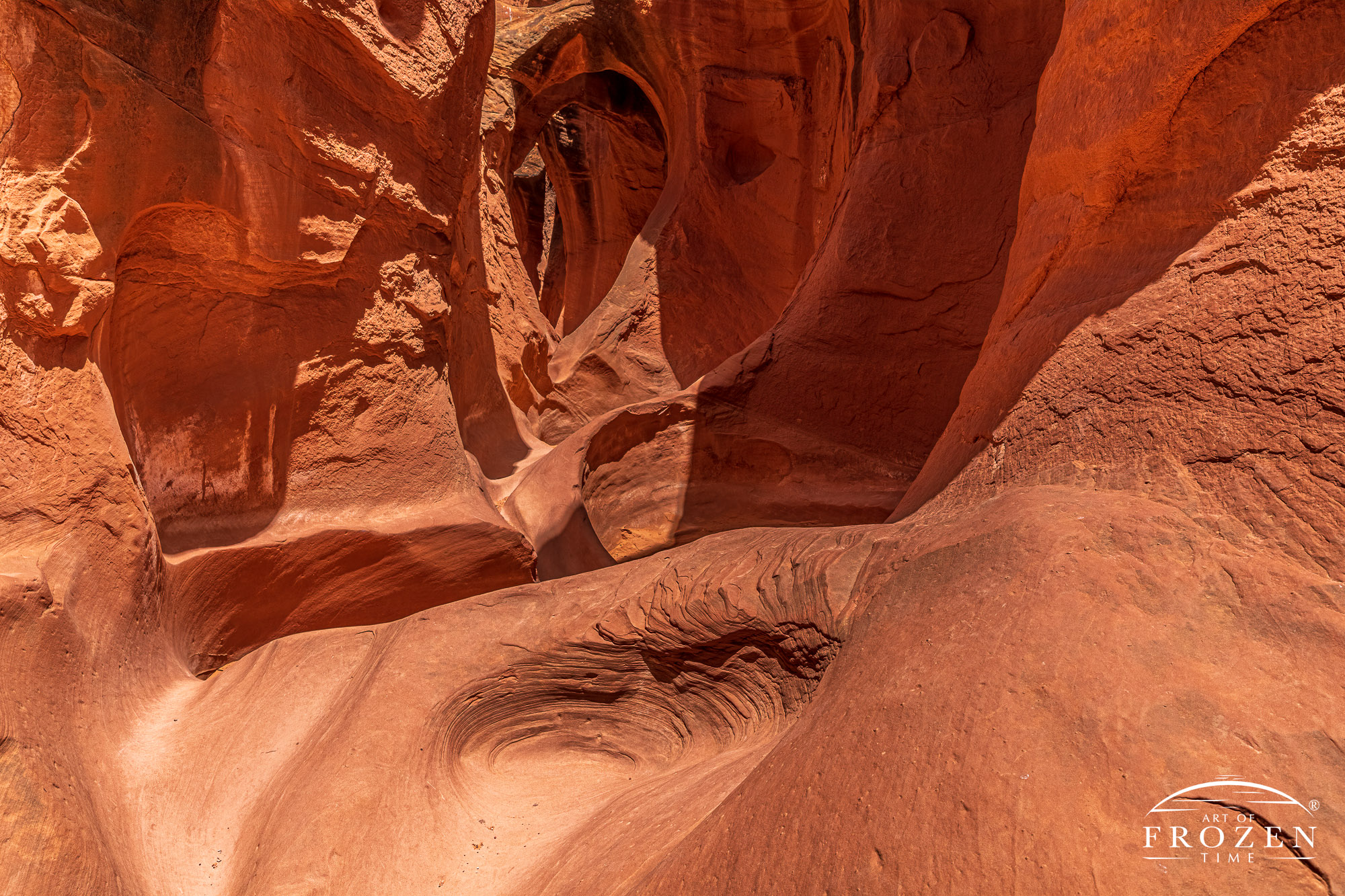 The iconic section of Peek-a-Boo Slot Canyon which shows a series of erosion cuts in the red Navajo Sandstone creating facinating textures and shapes