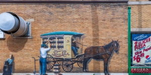 A mural of Pepsi salesman unloading his horse-drawn delivery wagon of bottle Pepsi