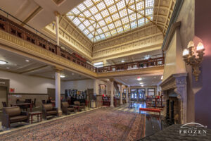 Interior view of Fort Piqua (now the Piqua Public Library) where the mezzanine, second floor skylights and stone fireplace emphasizes its architectural charm