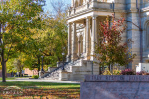 A cropped view of the Shelby County Courthouse where the autumn golden light shines on the south steps