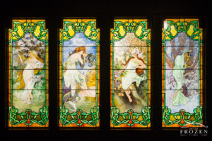A stained glass window in a museum on Chicago’s Navy Pier which featured four women representing the four seasons.