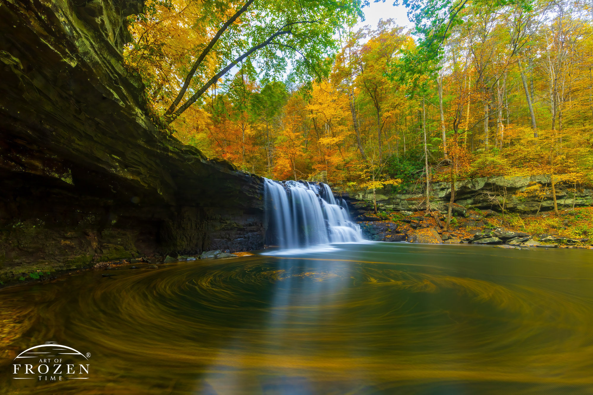 The stunning Brush Creek Falls in southern West Virginia during peak autumn colors where a 2-minute exposure revealed a gentle eddy created by the fall-colored leaves