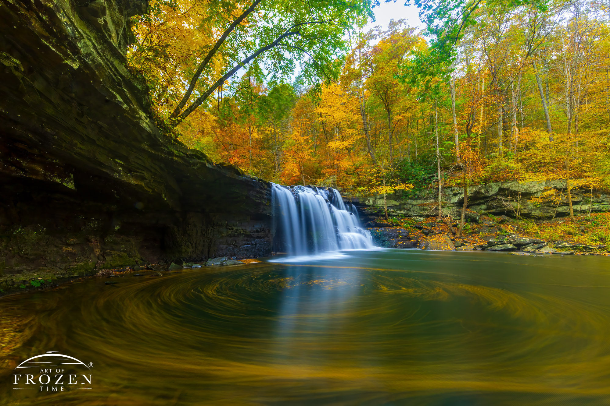 The stunning Brush Creek Falls in southern West Virginia during peak autumn colors where a 2-minute exposure revealed a gentle eddy created by the fall-colored leaves