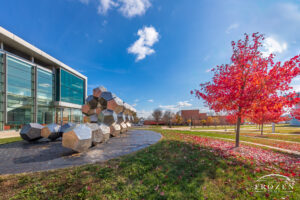 A fall scene at Wright State University where a stainless-steel sculpture consisting of many dodecahedrons mimic the DNA strands studied in the surrounding campus labs