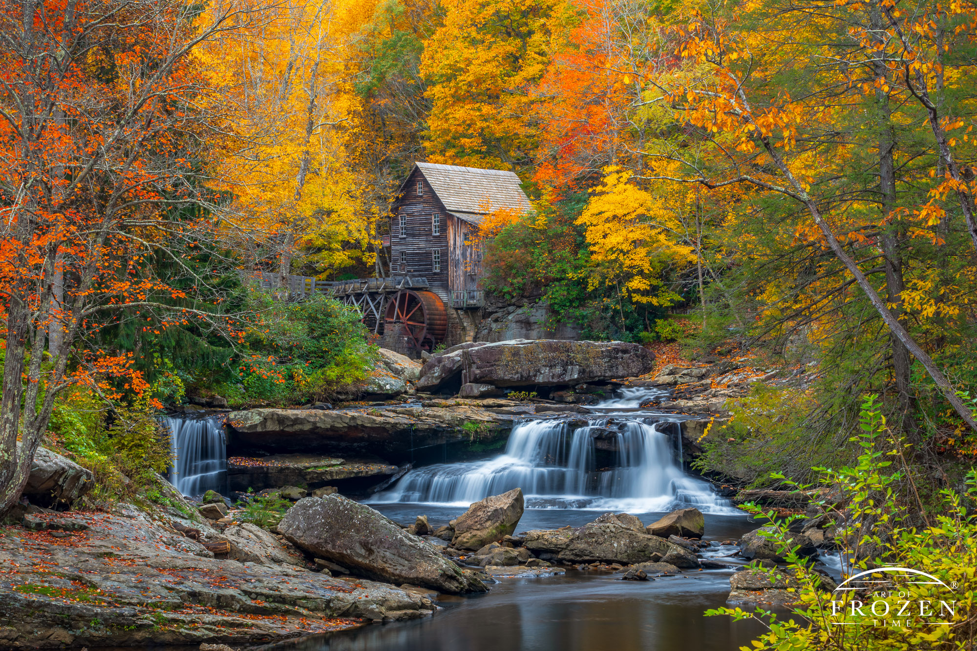 Fine Art Photography of Glade Creek Grist Mill nestled in fall color in Babcock State Park, West Virginia