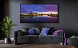 An AI room visualization featuring my fine art panorama print of the Dayton Skyline during blue hour where the day's last light illuminates the clouds in pink and purple hues