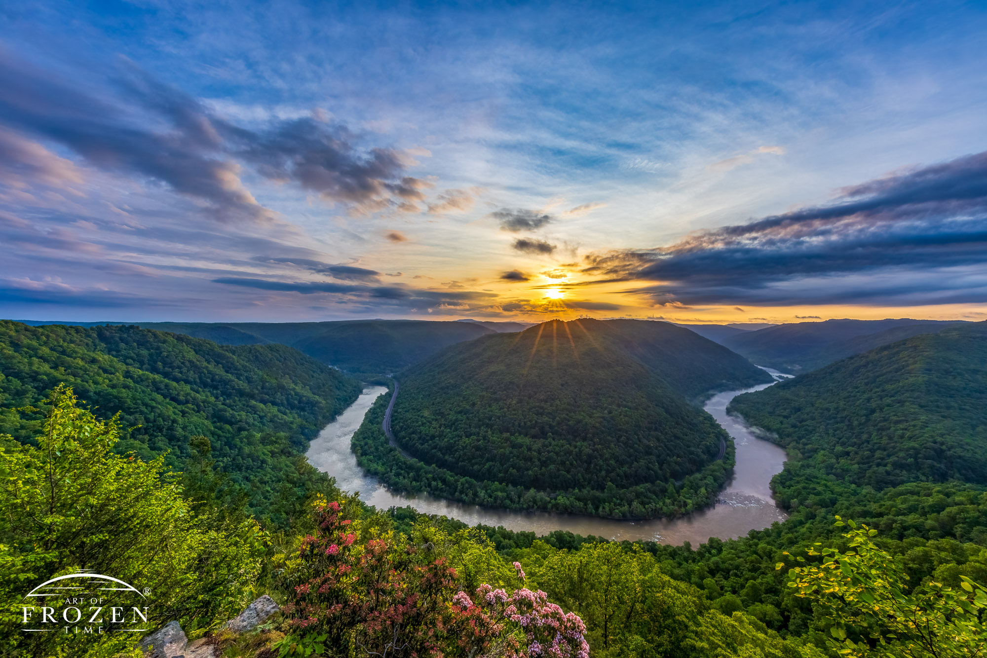 A horse-shoe bend as the New River meanders through West Virginia's sandstone and shale formations as dawn breaks over New River Gorge National Park