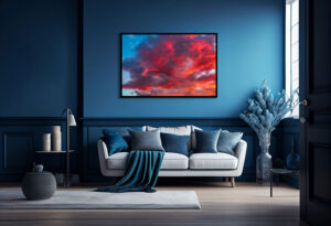 A room demonstration of a vivid art print featuring an underlit cloud at sunset. The red colors symbolize passion, while the blue hues instill a sense of calm and trust.